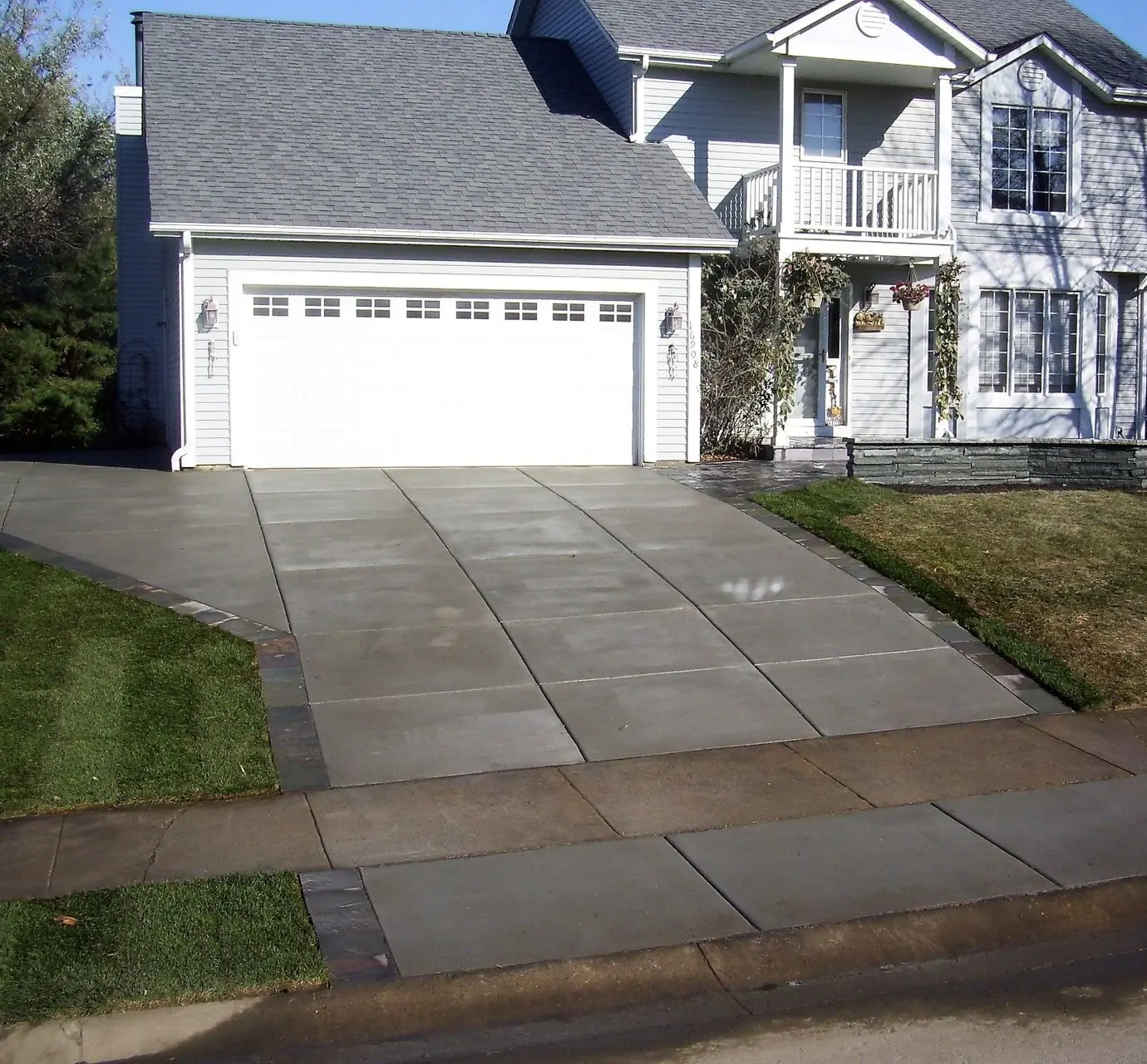 Concrete driveway installation near me, residential driveway contractors, modern driveway design, Minneapolis concrete driveways, best driveway paving services